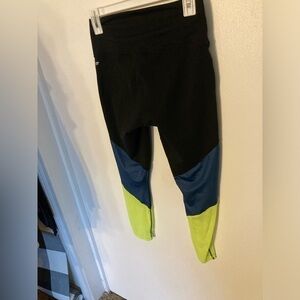 Fabletics Powerhold leggings in size Medium. Black with blue & neon yellow